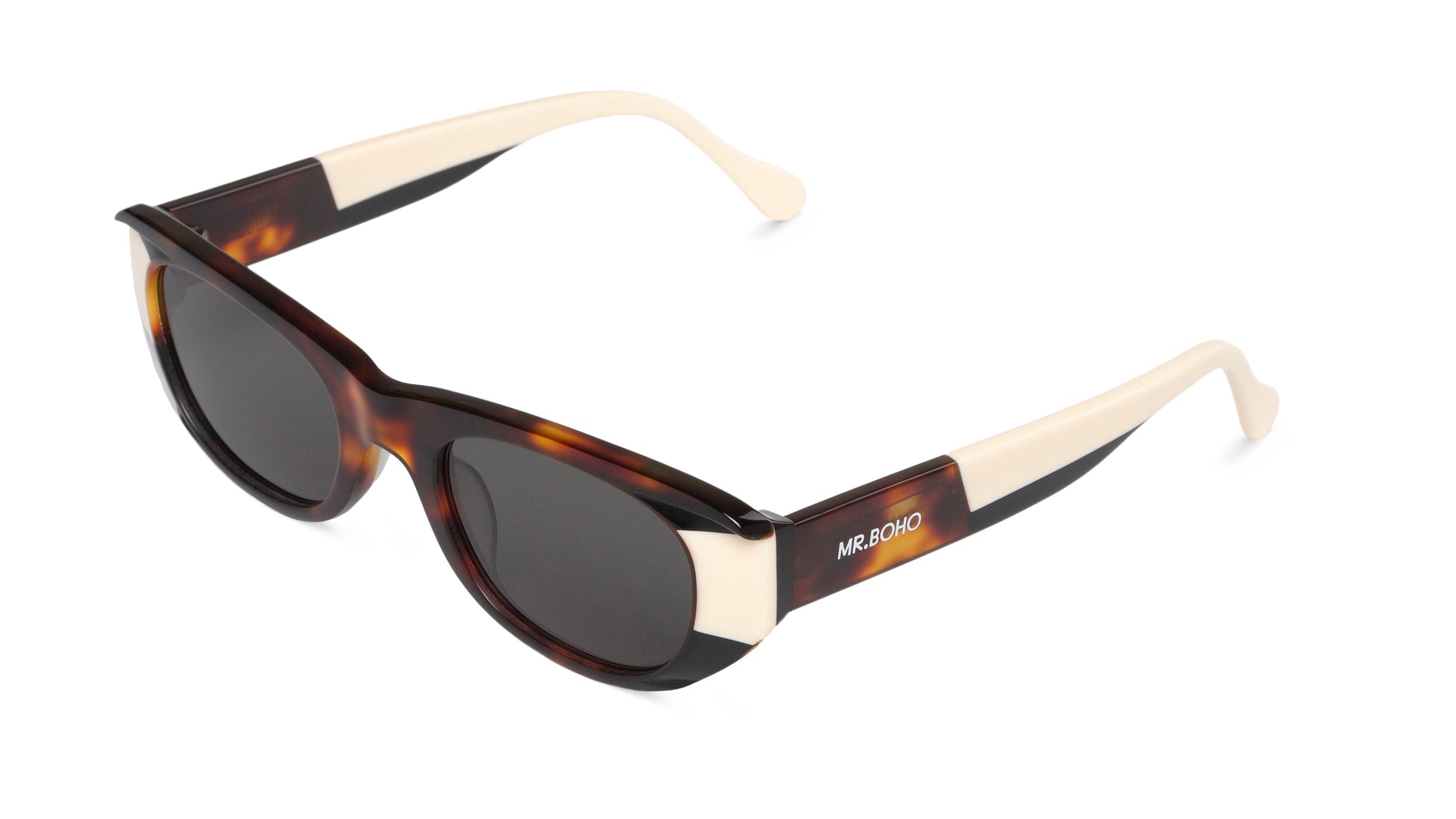 Rectangle with cat eye framed sunglasses in tortoiseshell with white accents and dark lenses. - arial view