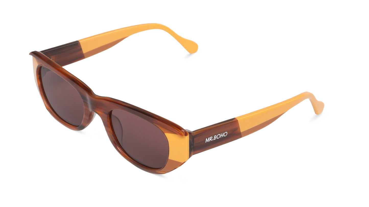 Rectangle with cat eye framed sunglasses in brown with orange accents and dark lenses- arial view
