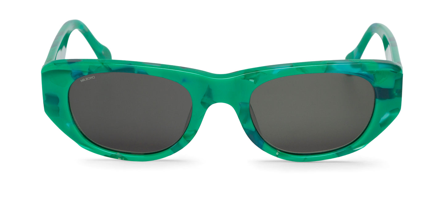 Rectangle with cat eye framed sunglasses in green mosaic pattern and dark lenses