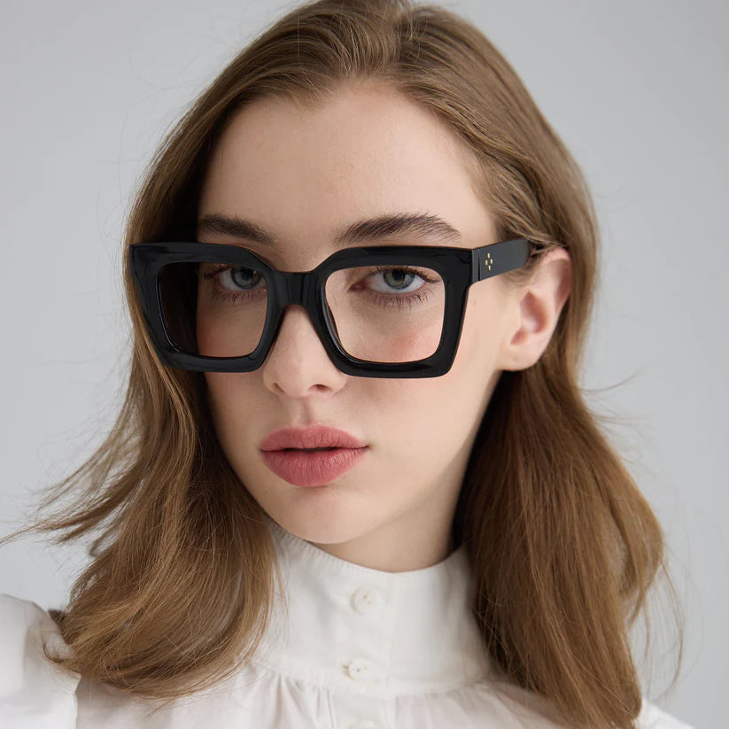 Woman wearing black square glasses