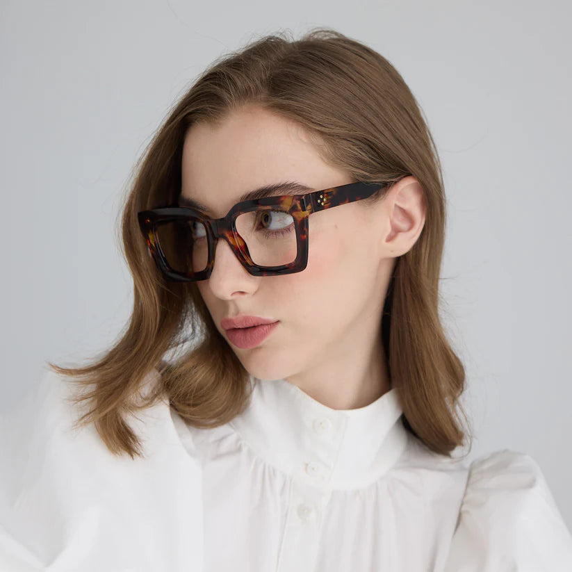 Woman wearing tortoiseshell square glasses