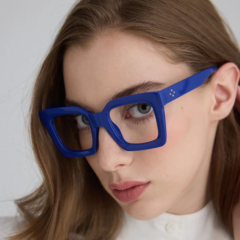 Women wearing blue square framed glasses