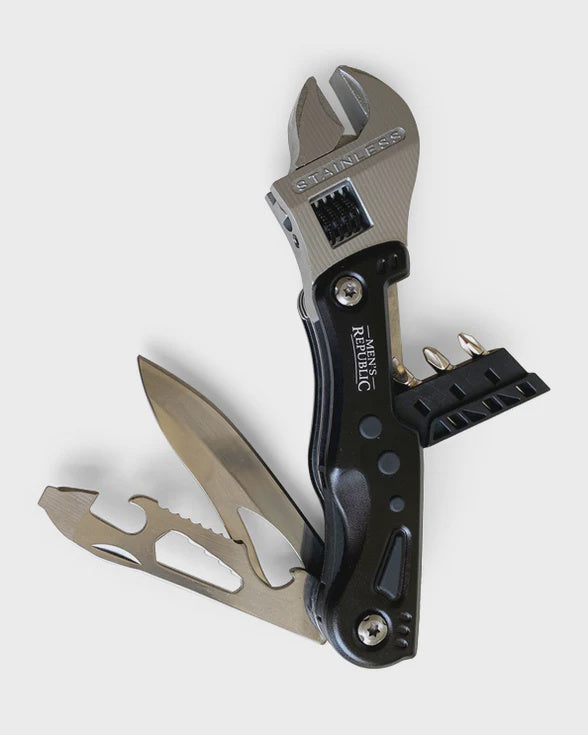 Multitool with knife and adjustable wrench on a white background