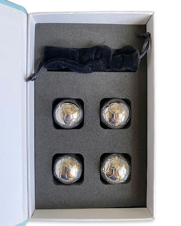 Four silver metallic objects in a box with a black velvet bag