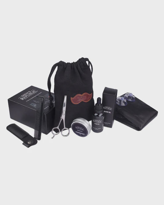 Collection of grooming products including a drawstring bag, scissors, bottles, and other items on a light gray background.