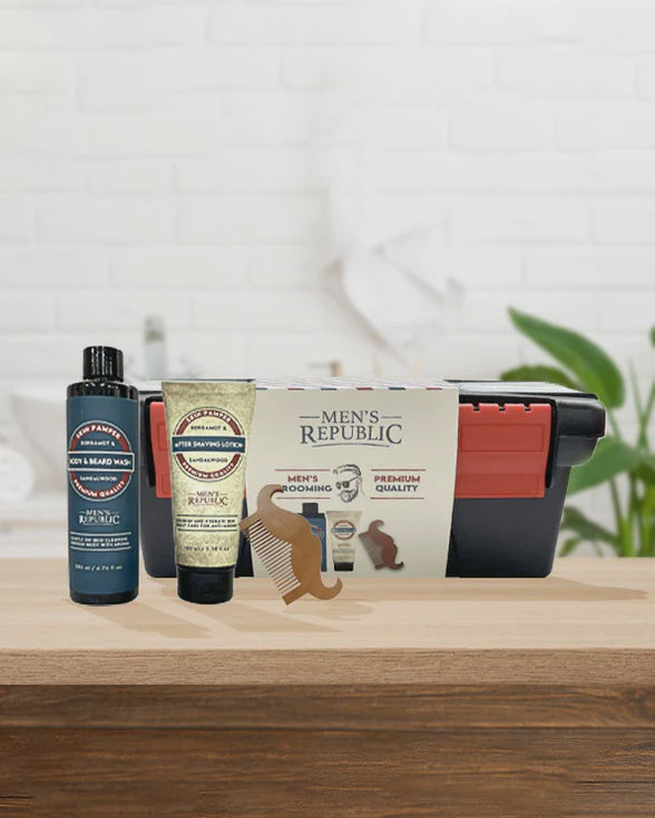 Men's grooming products including a bottle, tube, and comb on a wooden surface with a 'Men's Republic' branded box.