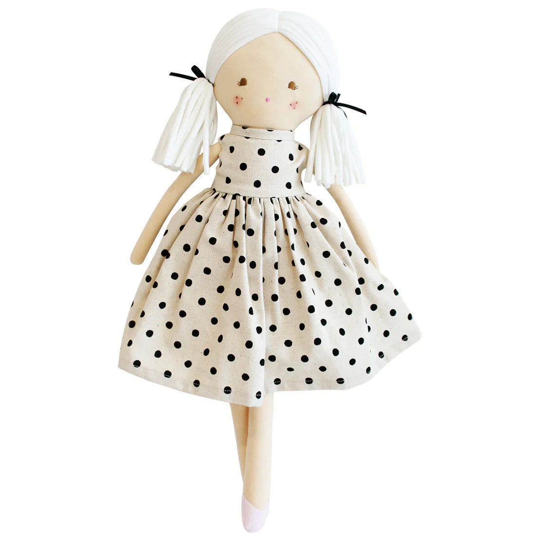 plush doll with white pigtails and linen dress with black spots