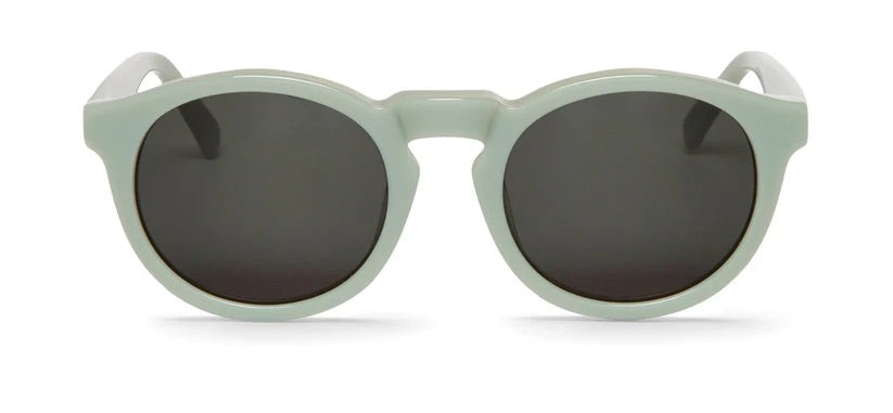 Round mint green sunglasses with dark lenses on a white background