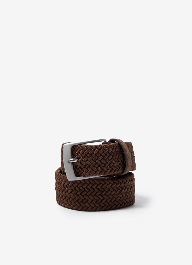 A beige elastic braided belt with a matte metal buckle, displayed against a white background.