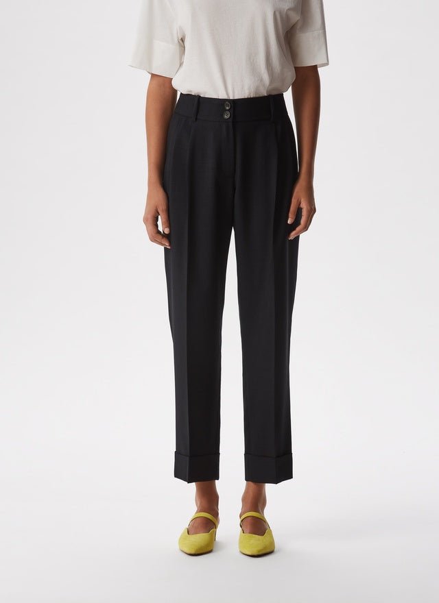Women Trousers | Black Ankle Length Elastic Trousers by Spanish designer Adolfo Dominguez