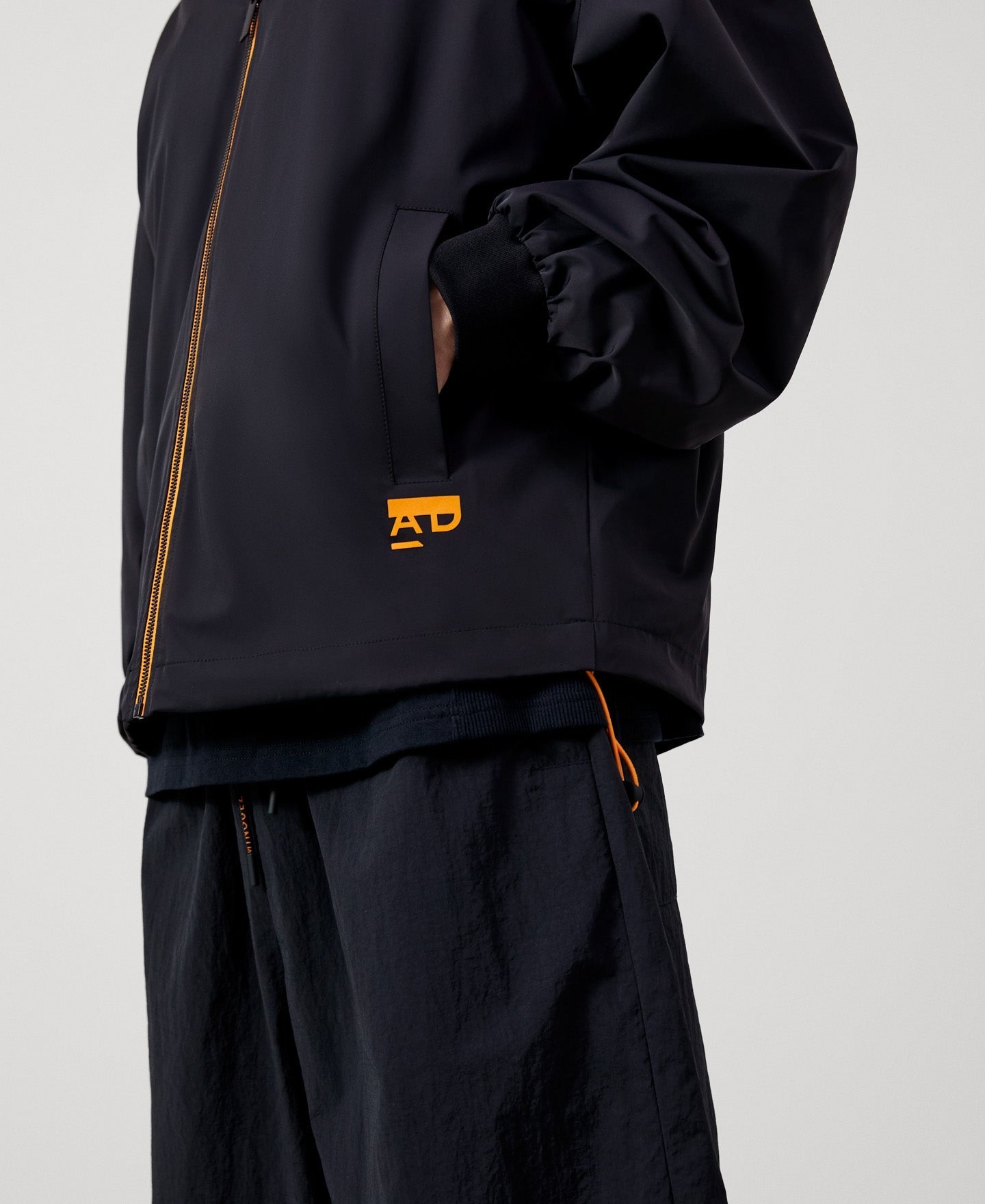 Men Jacket | Black Nylon Bomber With Backpack by Spanish designer Adolfo Dominguez