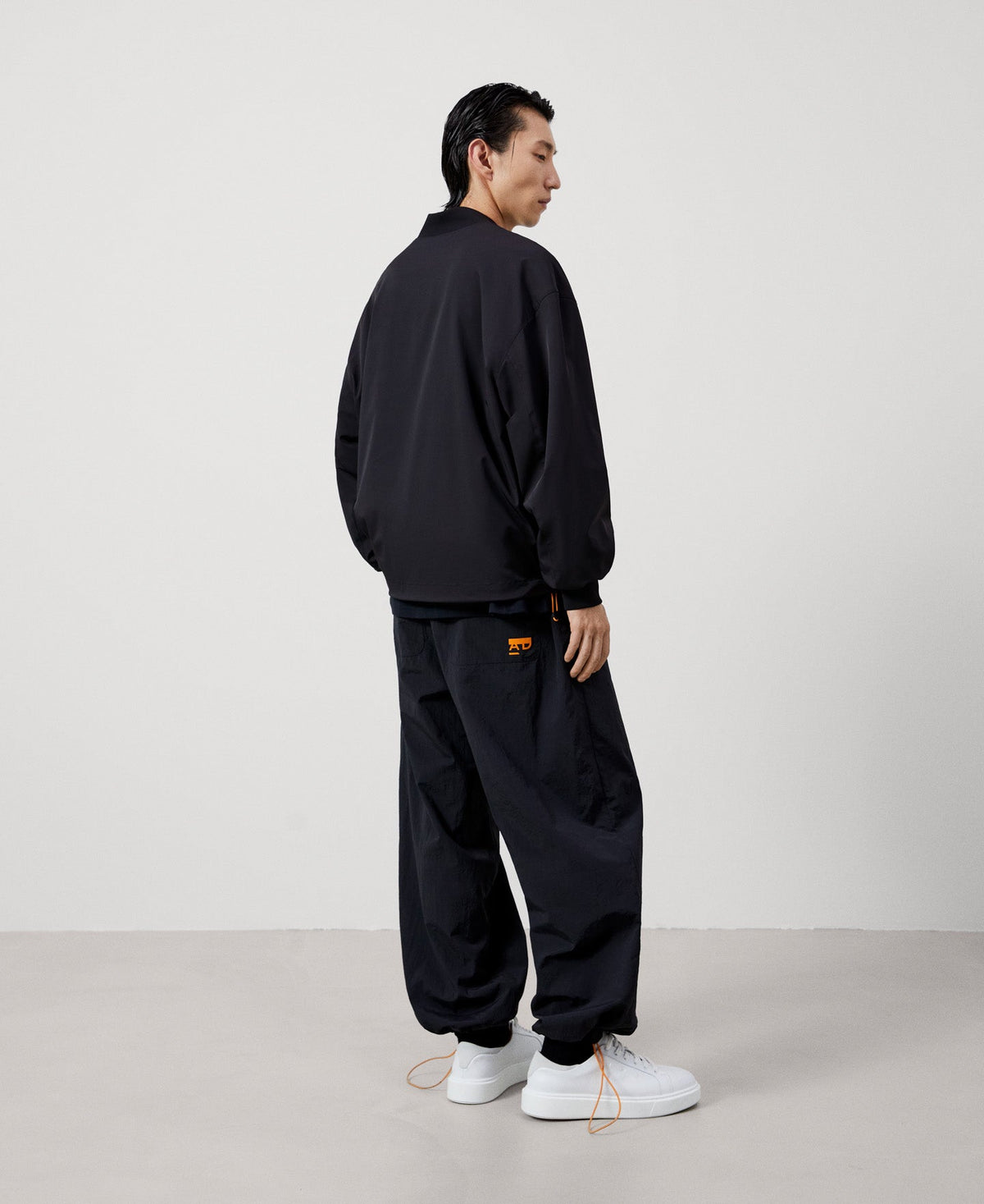 Men Jacket | Black Nylon Bomber With Backpack by Spanish designer Adolfo Dominguez
