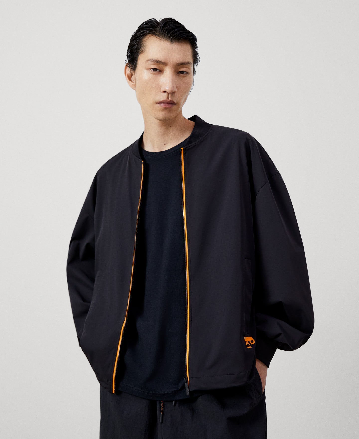 Men Jacket | Black Nylon Bomber With Backpack by Spanish designer Adolfo Dominguez