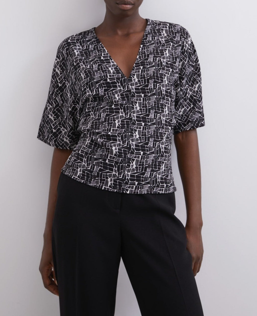 Women Short Sleeved Shirt | Black Print V-Neck Printed Top by Spanish designer Adolfo Dominguez