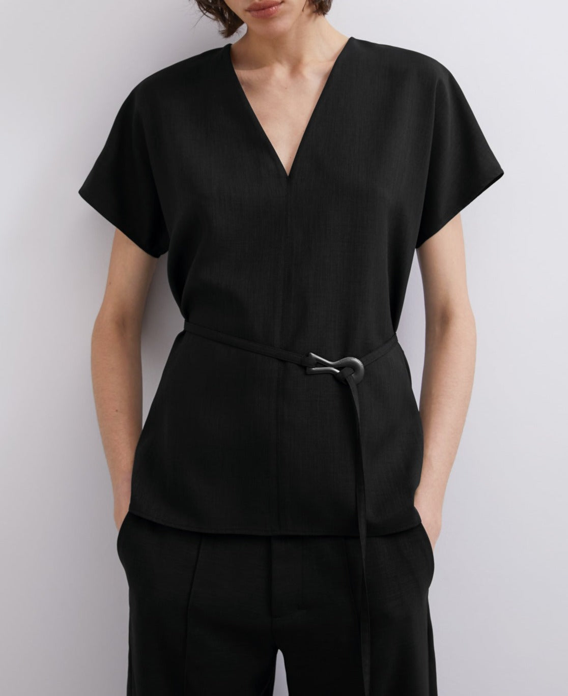 Women Short Sleeved Shirt | Black V Neckline Top With Belt by Spanish designer Adolfo Dominguez
