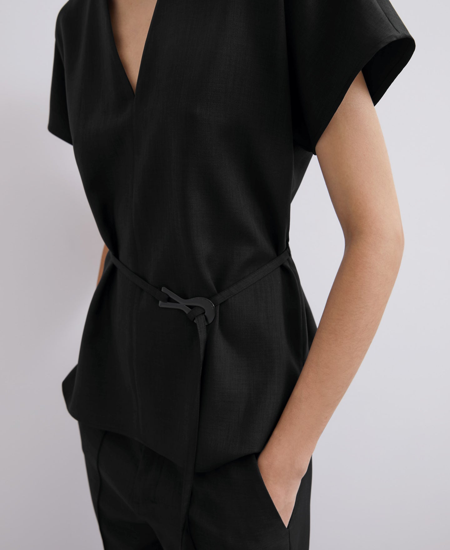 Women Short Sleeved Shirt | Black V Neckline Top With Belt by Spanish designer Adolfo Dominguez