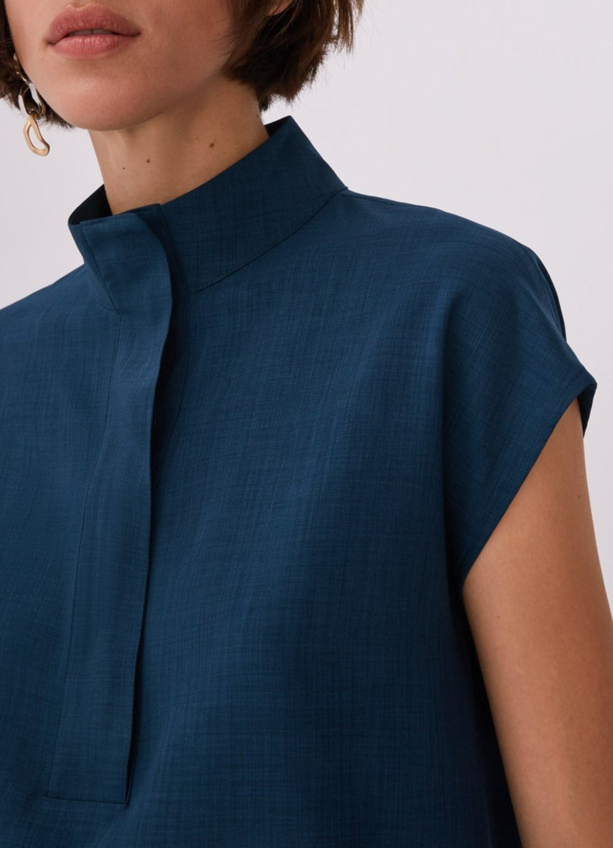 Women Short Sleeved Shirt | Blue High Collar Blouse With Flap by Spanish designer Adolfo Dominguez