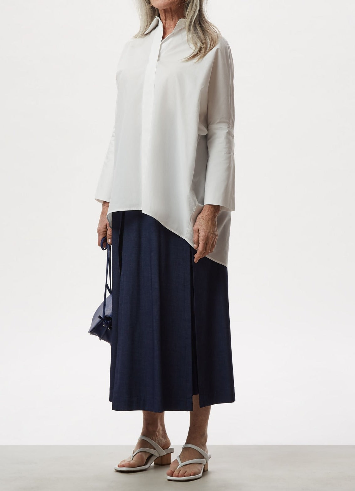 Uncategorised | Blue Pleated Midi Skirt With Overskirt by Spanish designer Adolfo Dominguez