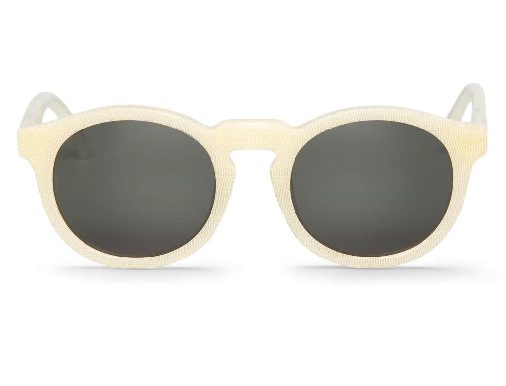 Round-shaped Sunglasses with beige frames and dark lenses on a white background