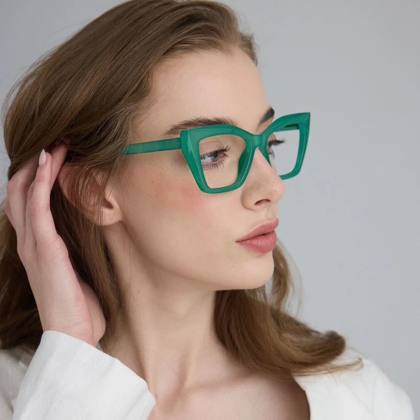 Woman wearing green cat eye framed glasses