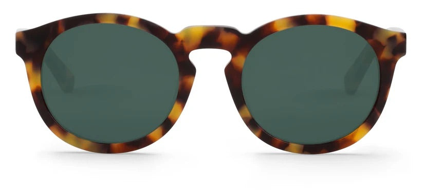Rounded sunglasses with tortoiseshell frame and dark lenses on a white background