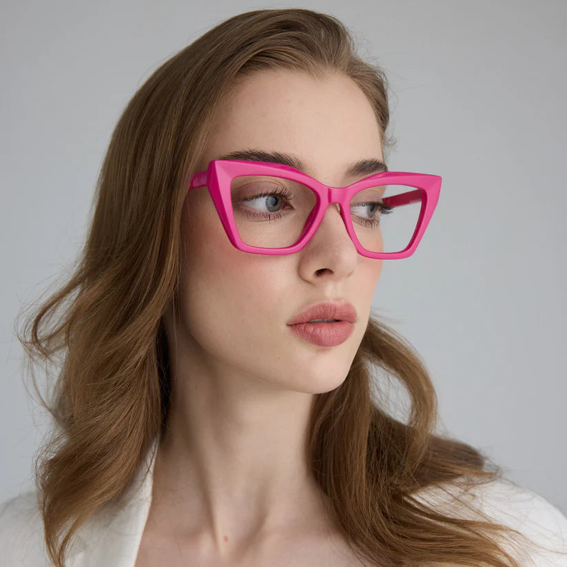Woman wearing pink cat eye framed glasses