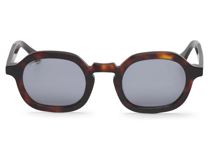 A pair of  tortoiseshell framed oval sunglasses with dark lenses.